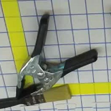 Metal clamp — successful transfer and placement in the final run.